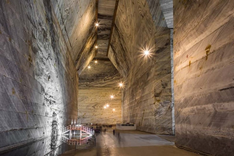 Bucharest: Salt Mine Guided Day Trip to Slănic - Entering a mine 208 meters below ground